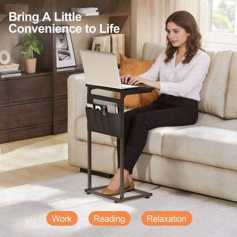 C Shaped End Table With Sliding Tray Under Sofa 28 Inch High Side Table With Storage Bag Black used by woman with laptop