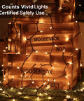 Clear Christmas Lights String With Brown Wire 21 Feet Long 100 Incandescent Bulbs Warm White Glow wrapped around wooden crates