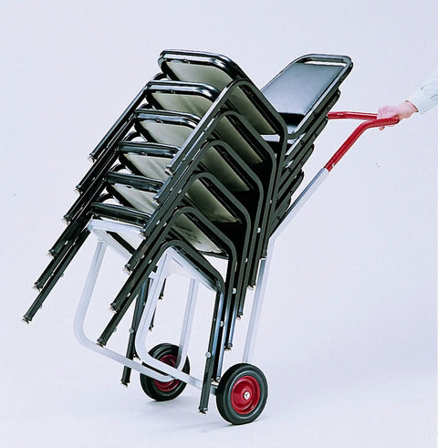 Raymond 500 Stacked Chair Dolly For Event Venues with stacked chairs, sturdy steel frame, and red handle for easy transport.