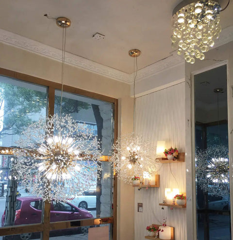 Gold 9 Light Crystal Ceiling Chandelier Pendant Lighting Fixture for Dining Room with sparkling crystals indoors.