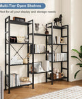 Triple Column 4 Tier Bookshelf With Adjustable Shelves in black, featuring decor and books in living room setting.