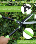 Hands using Heavy Duty Telescoping Hedge Shears 23 To 30 Inches With 20 Degree Angled Head on bush, ergonomic grip visible