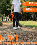 Person using Beefy Gas Powered Leaf Blower 3 In 1 Vacuum Mulcher Kit on a leafy path, showing 26cc 2 Cycle Handheld Engine.