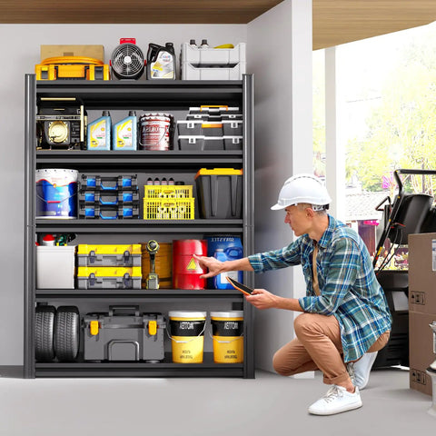 Man organizing garage with Beefy Five Tier Heavy Duty Metal Garage Shelving Unit With Adjustable Shelves For Garage Storage And Workshop Organization Perfect For Home Garage Warehouse Or Commercial Use filled with tools and supplies.