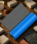 Badass Self Adhesive Roofing Underlayment Tape For RVs And Metal Roofs on wooden surface with bricks around it.