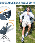 Man relaxing in heavy duty folding hammock chair with adjustable backrest and padded seat for outdoor comfort