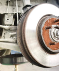 Close-up of wheel hub on vehicle with Copper Based Anti Seize Lubricant 11 Oz For High Temperature Fasteners Up To 1202 F.