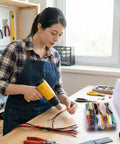 Person using a heat gun with 780 Piece Heat Shrink Tubing Kit With Case Assorted Colors And Sizes 2 To 1 Shrink Ratio Electrical Wire