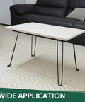 Built Tough 16.5 Inch Folding Hairpin Legs Four Pack Heavy Duty Iron Coffee Table Base Matte Black Finish with white tabletop.