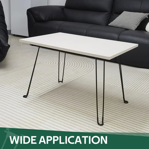 Built Tough 16.5 Inch Folding Hairpin Legs Four Pack Heavy Duty Iron Coffee Table Base Matte Black Finish with white tabletop.