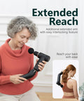 Woman using Deep Tissue Massage Gun With Detachable Extension Handle For Back And Shoulders Heated Percussion Massager.