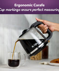 Replacement Glass Carafe For 12 Cup Coffee Makers Compatible With LMX TP MMX MSX Series pouring coffee into cup
