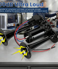 Kickin 12V Car Air Horn Kit Featuring Rip Roaring 120DB Dual Trumpets With Integrated Air Compressor Waterproof Electric Train Horn Upgrade For Tough Trucks And Rvs Matte Black Shell on a working table.