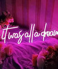 Personalized It Was All A Dream Neon Sign LED Wall Light for home decor, pink neon, 70 cm, surrounded by flowers.