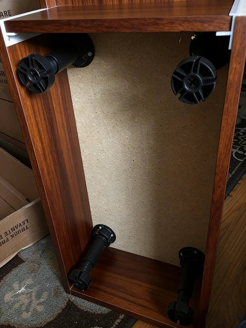 Adjustable Leveler Feet 3.9 to 5 Inches, 12 Pack Black Plastic Furniture Levelers installed on cabinet underside