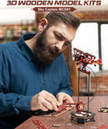 Man assembling 3D Wooden Puzzle For Grownups Gravity Swing Model Kit 163 Piece Set Recreating A Classic Biplane Gladiator