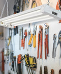 2 Ft LED Shop Light Fixture For Garage And Workshop, 20W, 2500 Lumens, 5000K Daylight, Clear Lens, Hanging Over Tools
