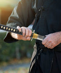 Practitioner using Lightweight Aluminum Katana Iaito for Iaido Training, Full Tang Practice Sword with 28 Inch Blade and Fuller Groove.