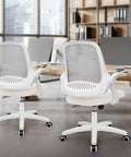 Two ivory ergonomic mesh office chairs with lumbar support and adjustable height in a modern office setup.