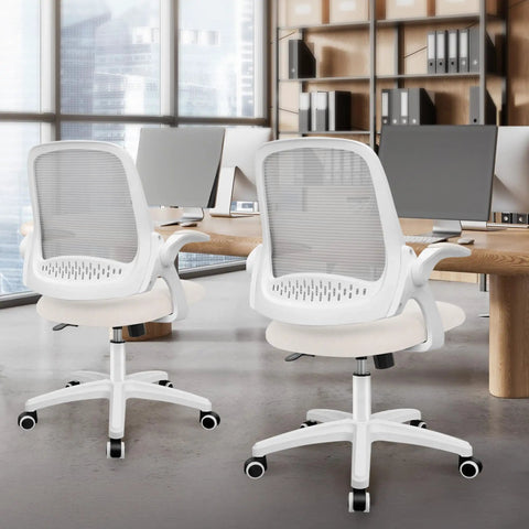 Two ivory ergonomic mesh office chairs with lumbar support and adjustable height in a modern office setup.