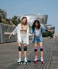 Two people roller skating with the 6 In 1 Protective Gear Set With Knee Pads Elbow Pads And Wrist Guards For Skateboarding Biking Roller Skating And Cycling Adults And Kids Durable Impact Resistant With Ventilated Foam For Comfort And All Day Safety.