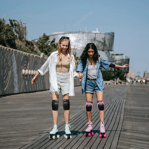 Two people roller skating with the 6 In 1 Protective Gear Set With Knee Pads Elbow Pads And Wrist Guards For Skateboarding Biking Roller Skating And Cycling Adults And Kids Durable Impact Resistant With Ventilated Foam For Comfort And All Day Safety.