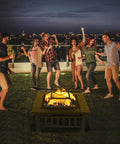 32 Inch Wood Fire Pit With Mesh Lid And Fire Poker Portable Outdoor Fireplace at a backyard party at night