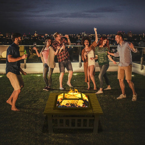 32 Inch Wood Fire Pit With Mesh Lid And Fire Poker Portable Outdoor Fireplace at a backyard party at night