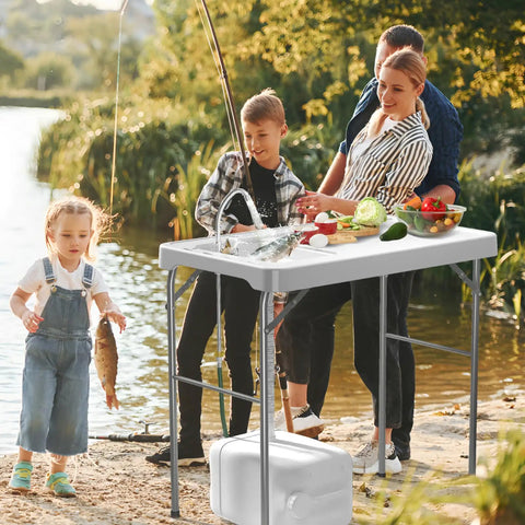 42.5 Inch Folding Fish Cleaning Table With Sink And Hose Hookup Portable Outdoor Fishing Station being used by a family