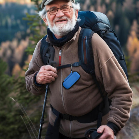 Elderly man hiking with Hard Travel Case For KardiaMobile EKG Monitors 1 Lead 6L 6L Max With Pill Box Carabiner Clip attached to backpack