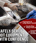 Heavy Duty 3 In 1 Panini Grill Brush Cleaner With Stainless Steel Scraper Tool cleaning a hot grill, ergonomic handle design, effective debris removal.