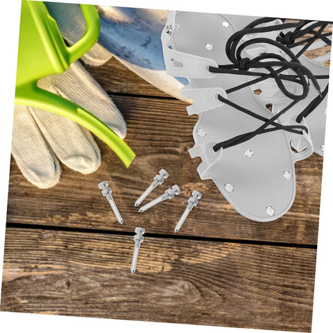Durable Lawn Aerator Shoes With Metal Spikes For Easy Grass And Lawn Care, includes spare spikes, placed on wooden surface