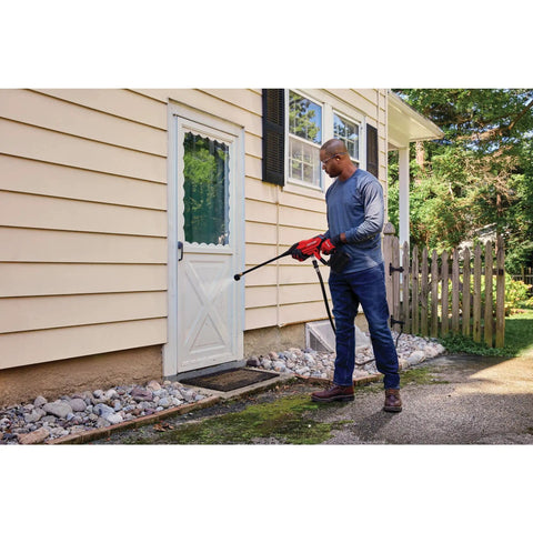Man using Cordless Pressure Washer Spray Gun Kit With 350 Max PSI, Extension, Soap Bottle, Battery And Charger Included on house exterior