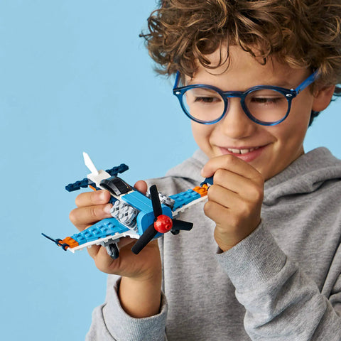 Child assembling 3 In 1 Propeller Plane Building Kit For Kids, Flying Toy Aircraft Set With 128 Pieces, Build Airplane Or Seaplane.