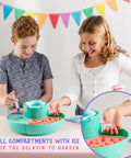 Kids using Ultimate Gummy Candy Making Kit For Home Use With Four Mold Shapes And Heating Base, close-up of ice tray.