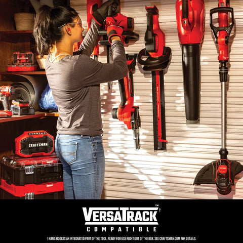 Woman organizing Cordless 20V Max Weed Wacker And Leaf Blower Combo Kit With Battery And Charger Included For Quick Yard Cleanup on wall