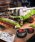 Claas Lexion 760 Remote Controlled Combine Harvester Building Blocks Kit MOC with assembly manual on wooden table
