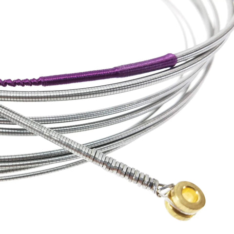 4 String Bass Flatwound Strings Set With Stainless Steel Precision Flats 38 Inch Winding Medium Gauge 45 105 Durable Long Lasting Tone For Jazz Blues And Modern Grooves Dope For Any Gig. close-up of silver bass flatwound strings with gold ball end