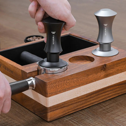 Person using Espresso Tamper 51mm With Dual Spring Load Delivers 30 Lb Constant Pressure, 2 Spring Options, on portafilter