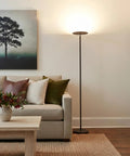 Sky Flux Dimmable LED Floor Lamp With 3 Light Modes For Living Room And Office Tall Torchiere Standing Torch Style Perfect For Bedroom And Reading 2700 Lumens Soft White 4000K Black next to sofa