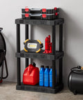 Rock Solid Black 3 Tier Plastic Storage Shelving Unit Badass Heavy Duty Free Standing Rack Supporting 50 Lbs Per Tier measuring 12 Deep By 20 Wide By 32 Inches For Closet Organization with tools and containers.