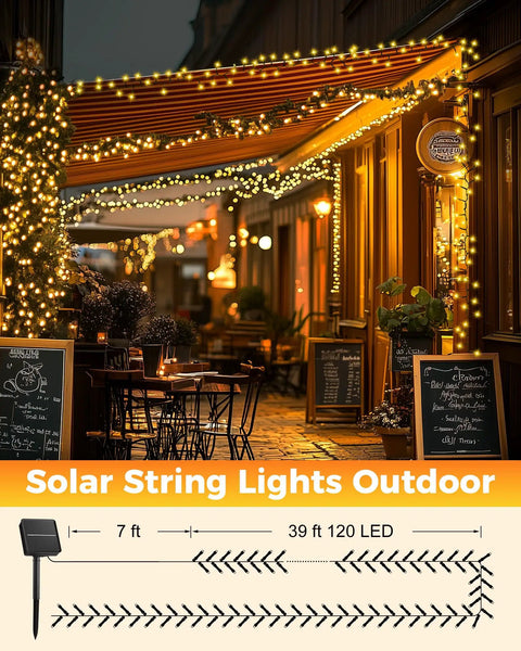 Two Pack 92Ft 240 LED Solar String Lights Outdoor Waterproof With Eight Modes For Patio Garden Yard Tree Decor Warm White No Outlet Needed Weatherproof And Easy To Set Up For Parties illuminating a cafe facade.