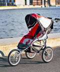 Jogging stroller with Rear 16x1.75 Tire And Inner Tube Set for Revolution Pro Flex SE Ironman, Stroller Strides models by a river.