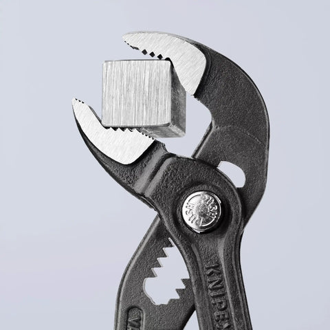 Cobra Pliers With One Handed Adjustment And Guard, 11-Position Fine Tuning For Different Sized Pieces, Hardened Teeth For Strong Grip gripping a metal cube