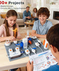 Space Theme STEM Kit With Voice Control For Kids Ages 8 To 12, 300 Plus Projects, Hands On Electronics Circuit Lab, Advanced Edition, Rocket Launcher And Lights, Great Gift For Curious Builders; kids building circuit on table