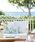 Outdoor setting with Coastal Throw Pillow Cover With Scalloped Edge, Water Repellent 20x20 Inches, Baby Blue Stripes on wicker couch