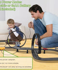 Father and son playing with Epic Slot Car Race Track Set With 23 Foot Track, 4 Cars, Battery Powered Or Electric, loop and crossover.
