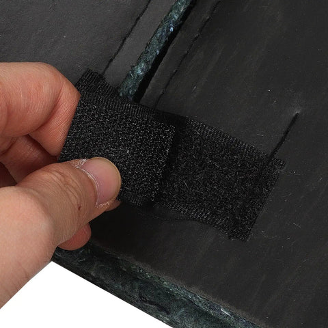 Close-up showing peel and stick backing of heavy duty black sound dampening foam panels for AC compressor.