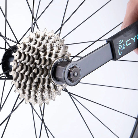 Must Have Cassette Removal Tool Set With Chain Whip And Lock Ring Tool For HG Cassettes And Freewheels on bike wheel in use