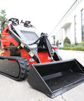 Stomp Mini Skid Steer Loader with 1800 lb Capacity and Lawn Scarifier Attachment for Small Jobs in outdoor setting